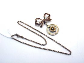 An Edwardian Style Openwork Pendant, stamped "15c", suspended below a 9ct gold bow brooch;