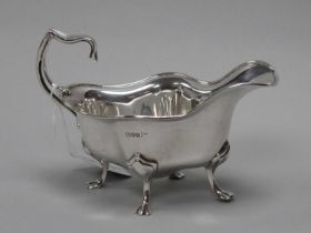 A Hallmarked Silver Sauce Boat, Walker & Hall, Chester 1907, of Art Nouveau shaped design, with