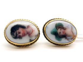 A Pair of Vintage Ceramic Panel Oval Earrings, each detailed with profile portrait, collet set on