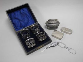 Art Deco Style Lorgnettes, together with a cased set of four thistle design plated napkin rings,