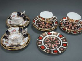 Two Coalport Porcelain Batwing PatternTrio's, within blue borders, two Royal Crown Derby Imari