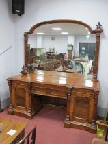 A Mid XIX Century Pollard Oak Mirror Back Sideboard, the arched top mirror with reeded column