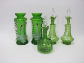 A Pair of Mary Gregory Style Green Glass Decanters, together with three further Mary Gregory style