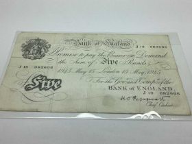 1945 K.O Peppiatt Bank Of England White £5 Banknote, together with four GB £1 banknotes.