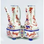 PAIR OF IMARI PATTERN EWERS ON STAND