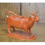 19TH-CENTURY POTTERY COW CREAMER