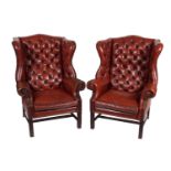 PAIR OF HIDE UPHOLSTERED WINGBACK ARMCHAIRS