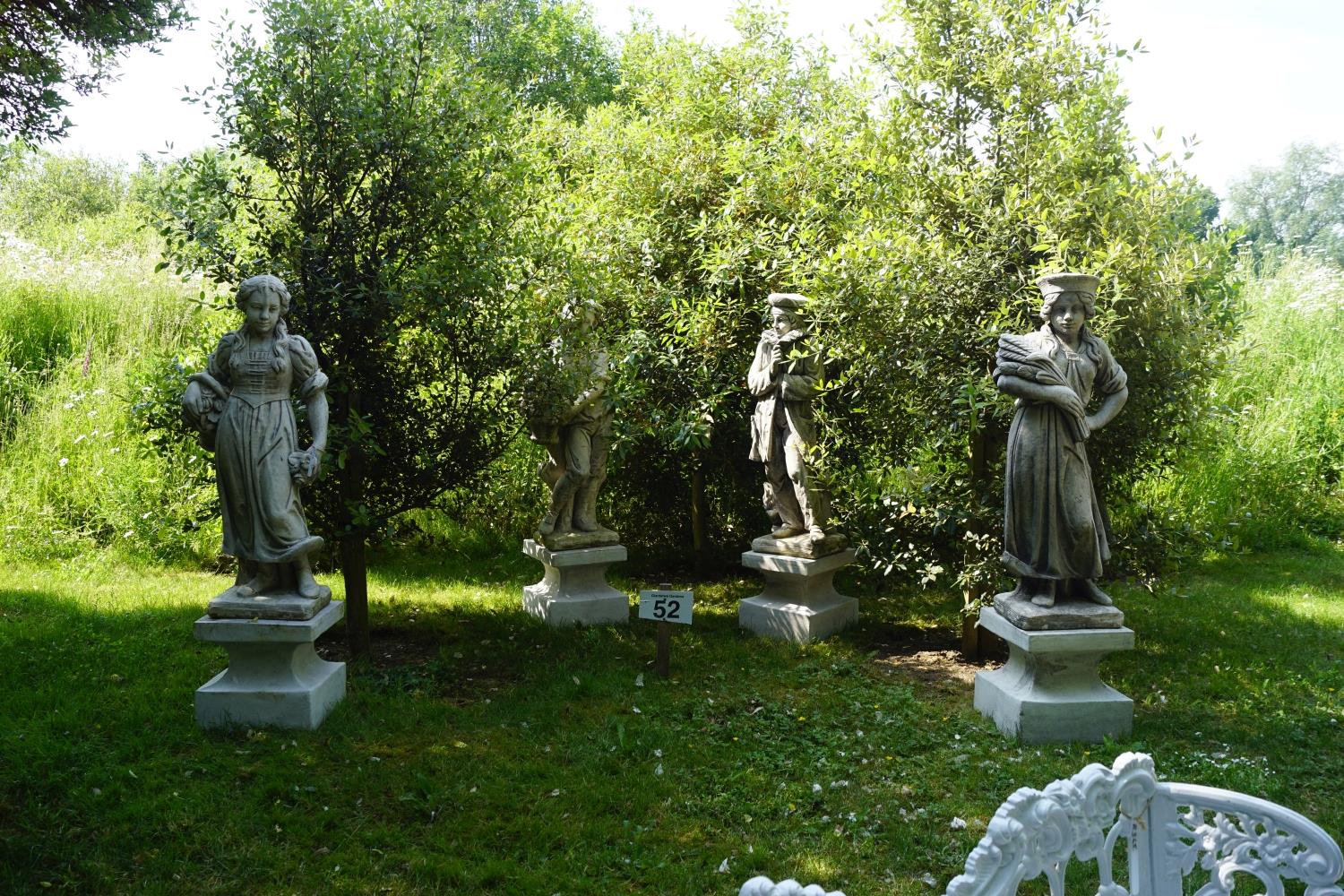 SET OF FOUR MOULDED STONE FIGURES