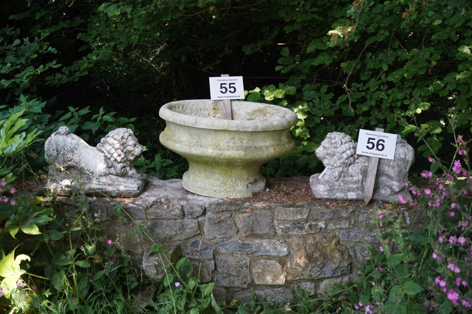 PAIR WEATHERED MOULDED STONE LIONS