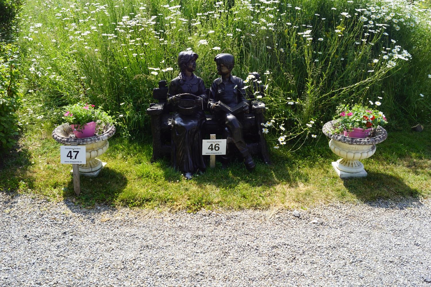 PAIR OF ITALIANATE STONE URNS