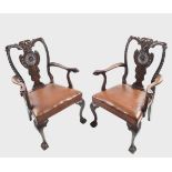 PAIR DUBLIN CARVED MAHOGANY ELBOW CHAIRS