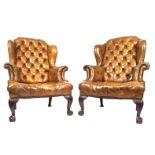 PAIR OF 19TH-CENTURY HIDE WINGBACK ARMCHAIRS