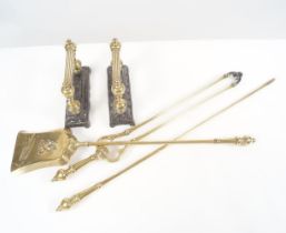 SET OF 19TH-CENTURY BRASS FIRE DOGS AND FIRE IRONS