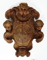 18TH-CENTURY CARVED WOOD ARMORIAL PLAQUE