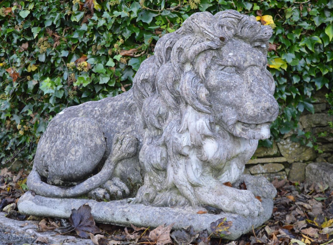 PAIR OF LARGE MOULDED STONE LIONS.