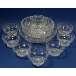 A set of seven Stuart cut glass dessert dishes, a jug and two cut glass fruit bowls