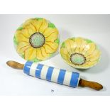 A Hillwood 1930's sunflower strainer dish and a Cornishware rolling pin