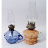 A Victorian mottled orange glass finger lamp and a blue glass one