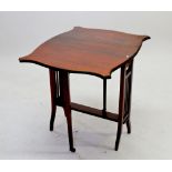 An Edwardian mahogany Sutherland table with shaped top and slatted ends, 61cm wide