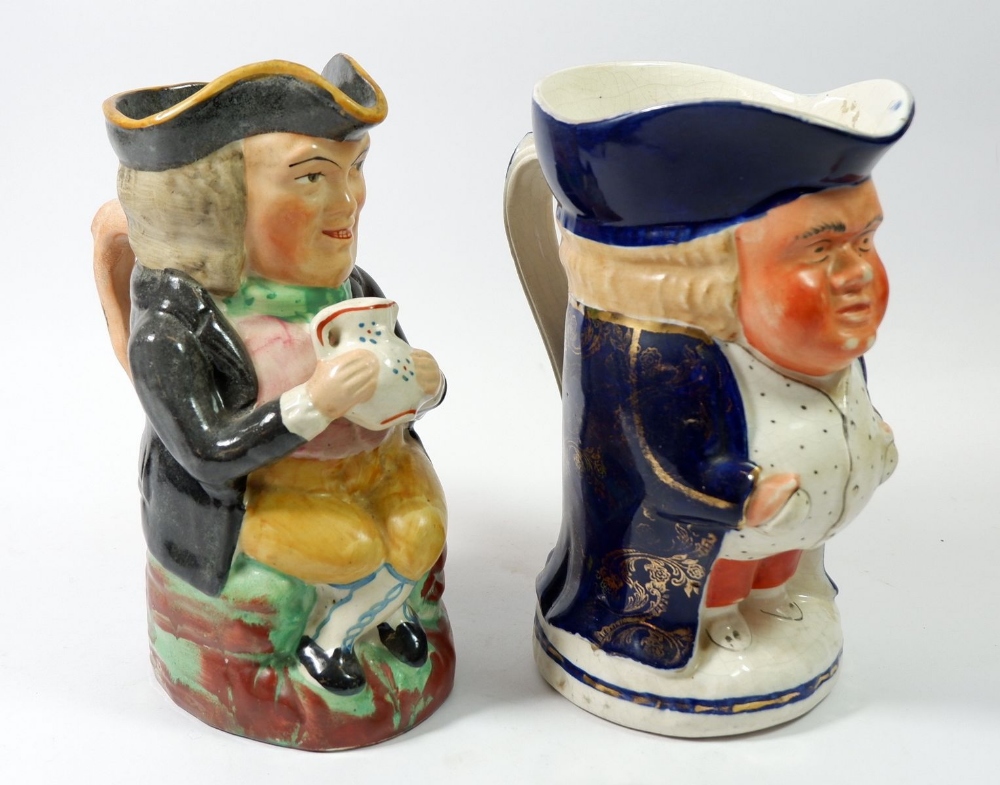 A large Victorian Toby jug holding mug, 23cm and another Toby jug