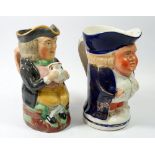 A large Victorian Toby jug holding mug, 23cm and another Toby jug