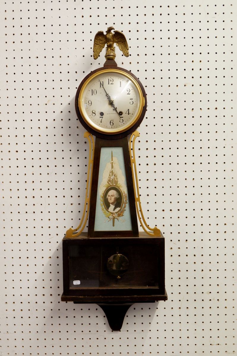 A Seth Thomas American wall clock with eagle surmount, 72cm tall