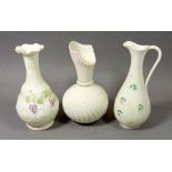 Two Belleek vases and a jug, 18cm tall