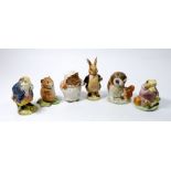 A collection of six early Beswick Beatrix Potter figures including: Mrs Tiggy Winkle, Mrs Flopsy