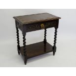 A late Victorian Jacobean style carved oak side table with frieze drawer and barleytwist supports