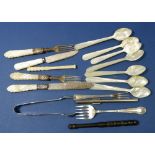 A group of silver and mother of pearl cutlery including seven mother of pearl spoons