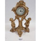 A New Haven USA gilt cast cherub wall clock, 21cm high