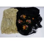 A black silk fringed shawl and a metallic and lace early 20th century shawl
