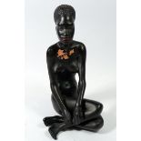 A Gmundner Keramik Fink African seated female figure , 25cm tall