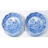 A pair of Spode shell form serving dishes printed pastoral landscapes - one repaired