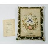 A silk cushion 'A Memento of The Great Exhibition' 1851 with floral design and card explanation,