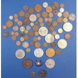 A miscellaneous lot of world coins and medallions including: some silver content pre-decimal and