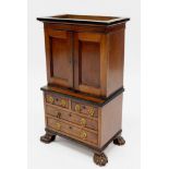 A fine late 19th century apprentice piece in the form of a linen press with ebony mouldings and