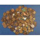 A quantity of world coins mainly British pre-decimal including: farthings, pennies, brass