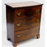 A Victorian mahogany bow fronted three drawer chest of drawers on bracket feet, 77cm wide x 88cm