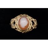 A 9 carat gold ring with worn cameo within intwined setting, size N to O