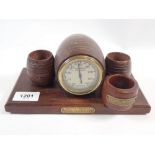 A Rototherm thermometer made of teak from HMS Warsprite with napkin ring from same warship