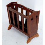 A Liberty oak magazine rack with pierced tulip cut outs to ends, replacement base 49cm