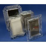 Four various cut glass picture frames including Waterford and Edinburgh crystal examples largest,