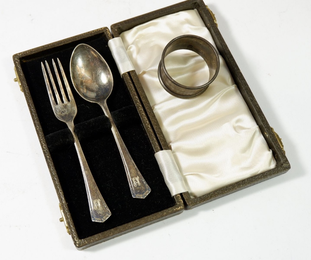 A silver napkin ring and silver plated child's spoon and fork