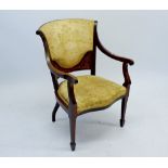 An Edwardian mahogany framed open armchair with upholstered and marquetry panel back