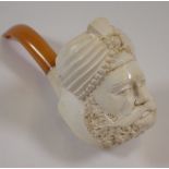 A Meerchaum pipe in the form of an Eastern man with turban, with amber mouthpiece