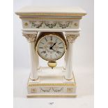 A Franklin Mint floral porcelain Empress Josephine Portico clock, striking on a bell, hairline to