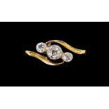 An 18 carat gold three stone crossover ring with 9 carat gold size insert, size N to M approx