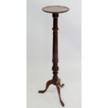 A mahogany jardiniere stand on turned column and triple supports, 108cm tall