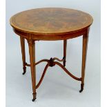 An Edwardian flame mahogany centre table with inlaid classical marquetry decoration to top all on